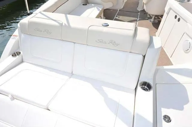 Slide: The Image of 2012 Sea Ray 260 Sundeck boat interior with white seating and cup holders. - 7