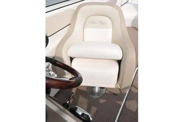Slide: The Image of 2012 Sea Ray 260 Sundeck captain's chair with elegant white upholstery. - 9
