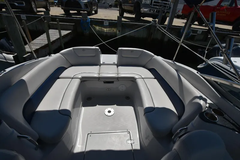 Slide: The Image of 2011 Crownline 265 SS boat interior with spacious seating and cup holders. - 10