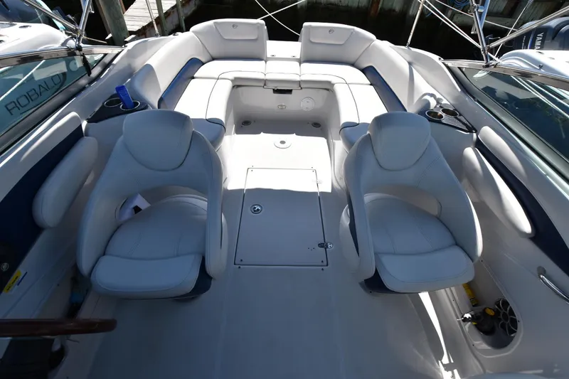Slide: The Image of 2011 Crownline 265 SS boat interior with white seating and spacious layout. - 12