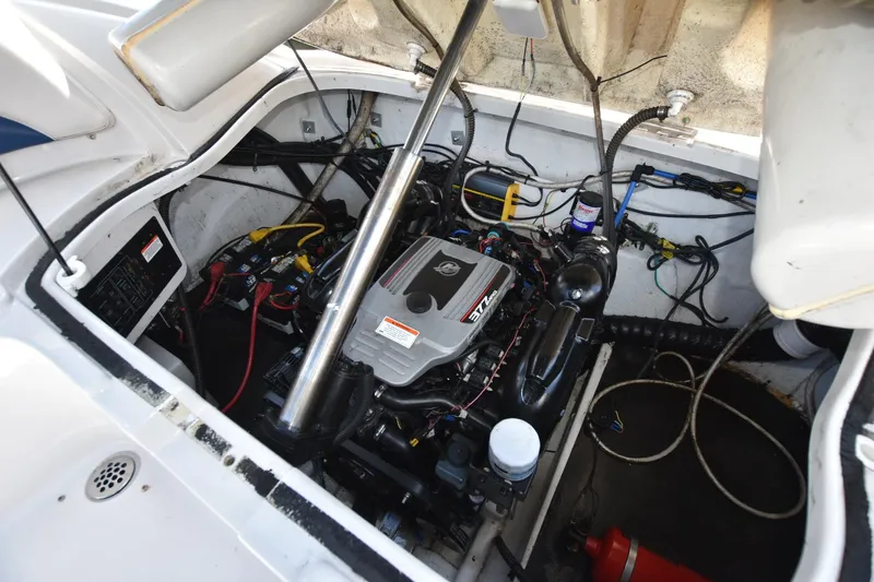 Slide: The Image of Engine compartment of a 2011 Crownline 265 SS boat, showcasing detailed mechanical components. - 15