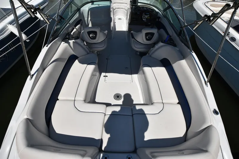 Slide: The Image of 2011 Crownline 265 SS boat interior with spacious seating and modern design. - 16