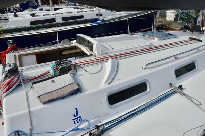 Slide: The Image of 1998 J Boats J/120 sailboat with sleek deck design and rigging details. - 10