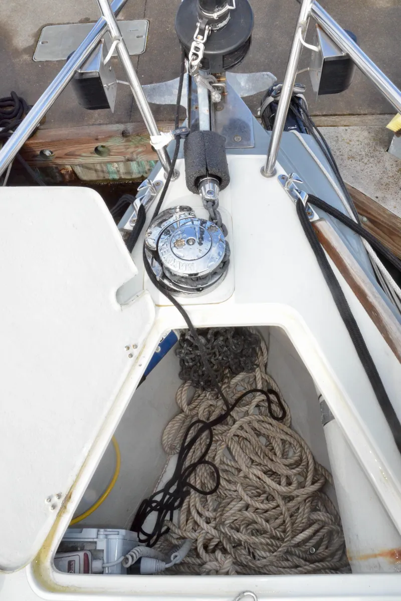 Slide: The Image of Anchor locker of 1998 J Boats J/120 sailboat with ropes and anchor chain. - 13
