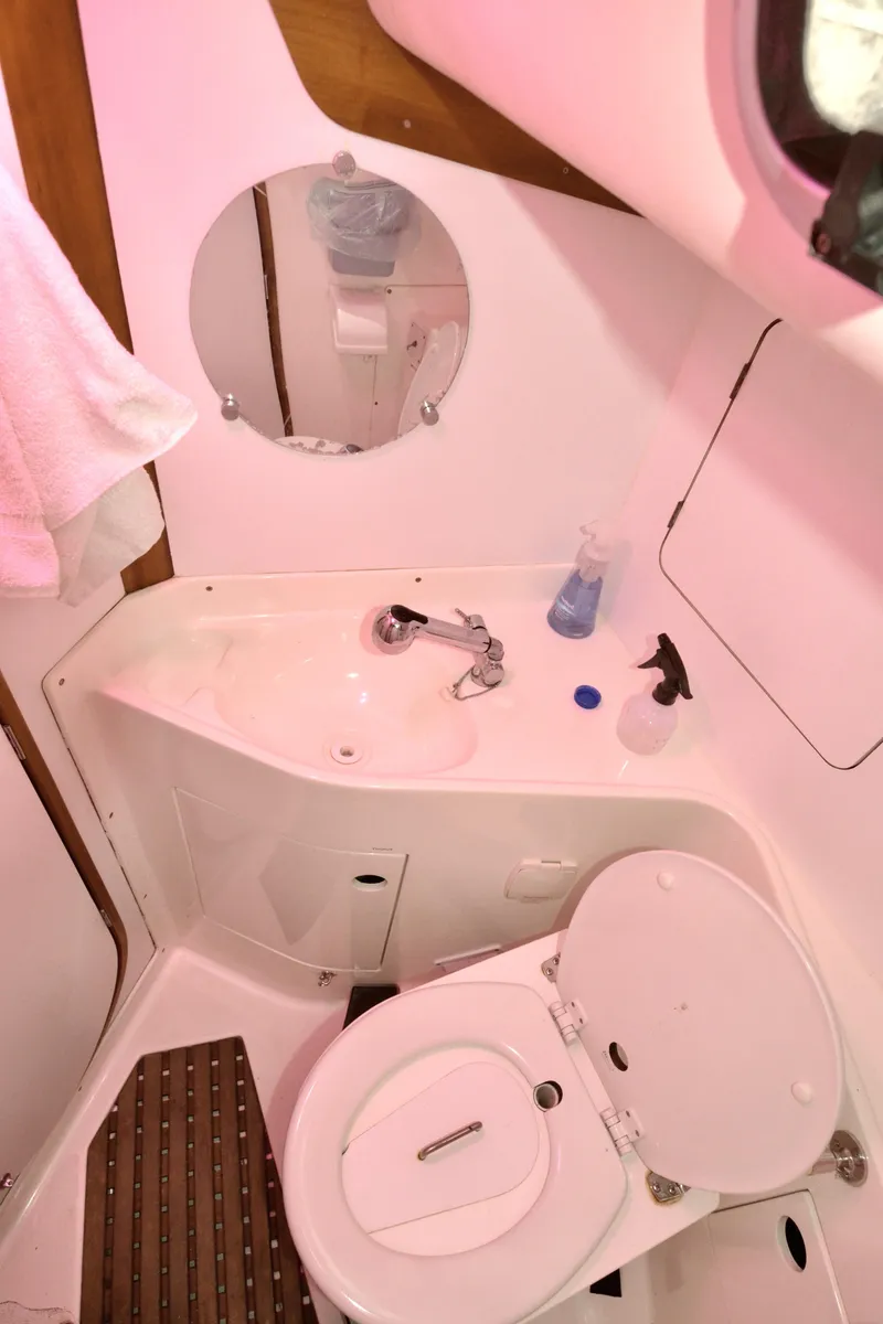 Slide: The Image of 1998 J Boats J/120 yacht bathroom with sink, toilet, and mirror. - 41