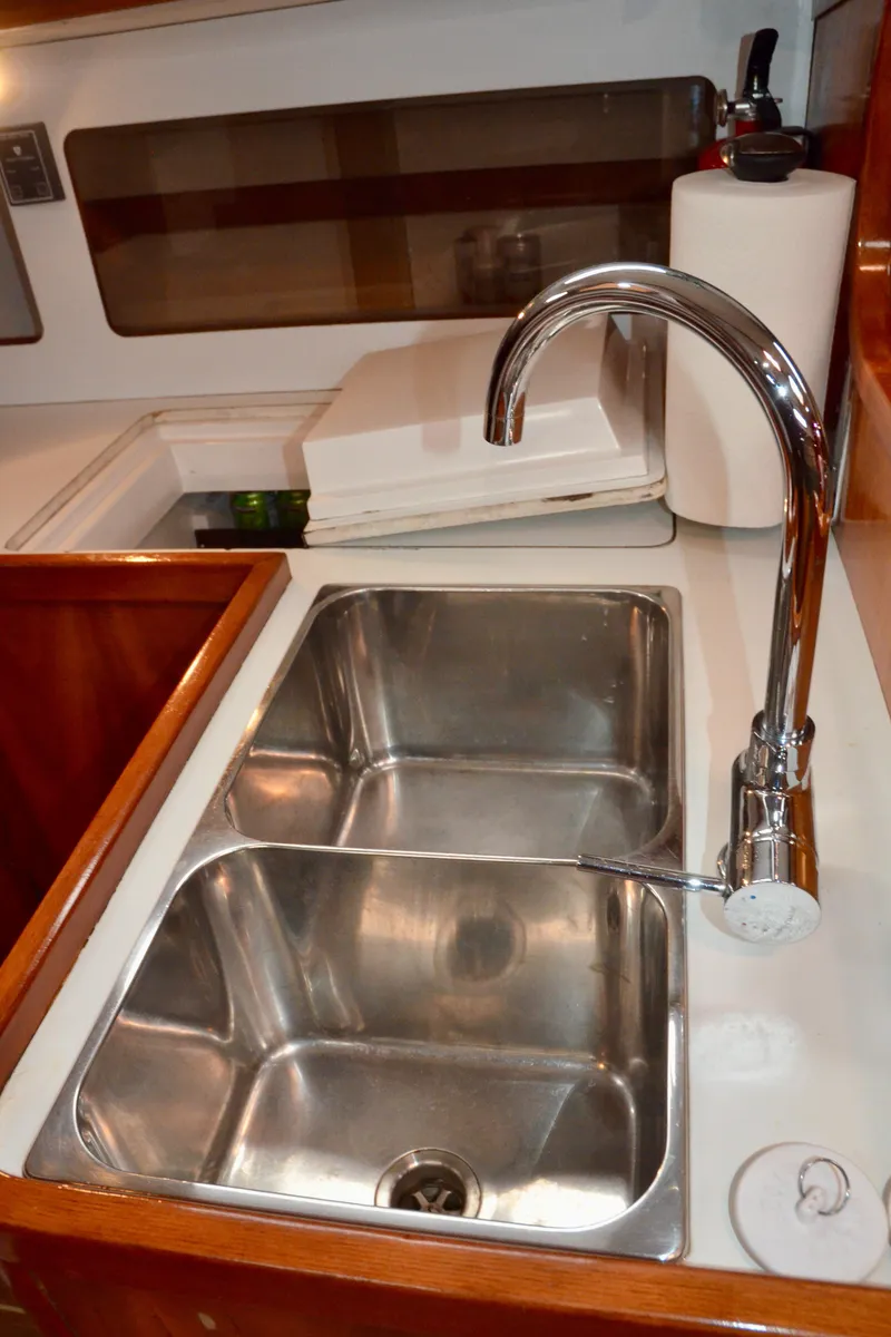 Slide: The Image of Stainless steel double sink in 1998 J Boats J/120 yacht galley. - 48