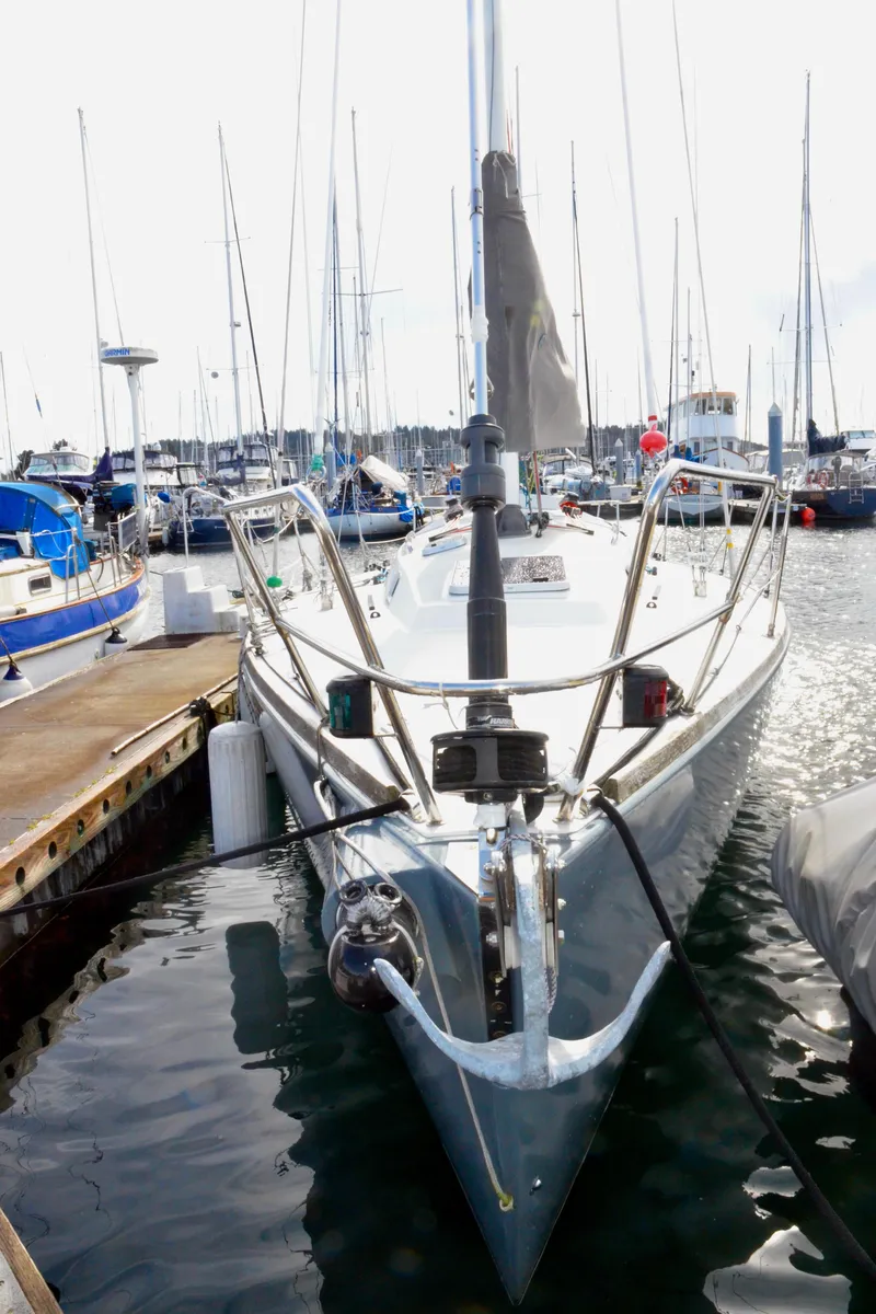 Slide: The Image of 1998 J Boats J/120 sailboat docked in a marina, front view. - 5