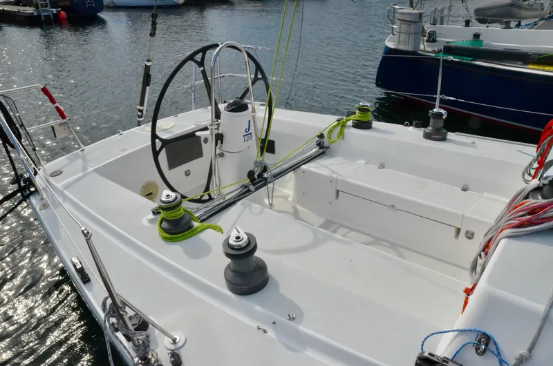 Slide: The Image of Cockpit of a 1998 J Boats J/120 sailboat with steering wheel and winches. - 9