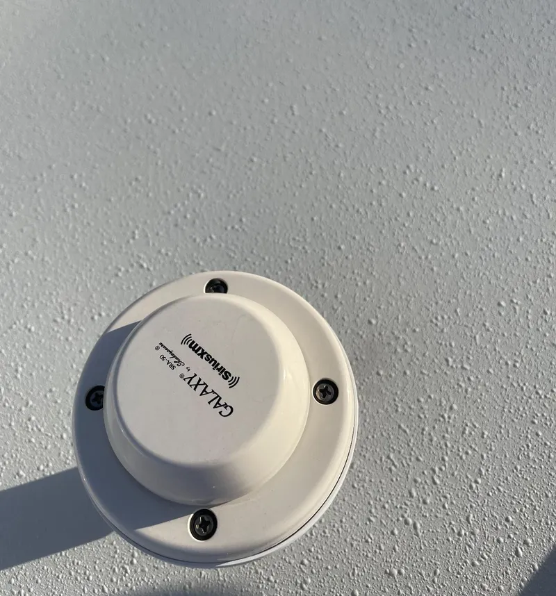 Slide: The Image of Galaxy antenna mounted on 2018 Contender 24 Sport boat surface. - 21