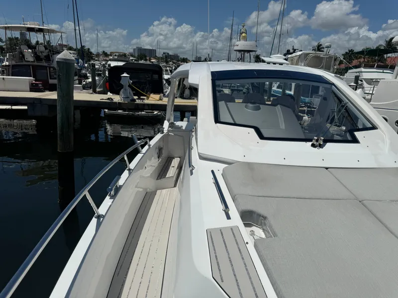 Slide: The Image of 2019 Azimut Verve 40 yacht docked at marina under clear skies. - 10