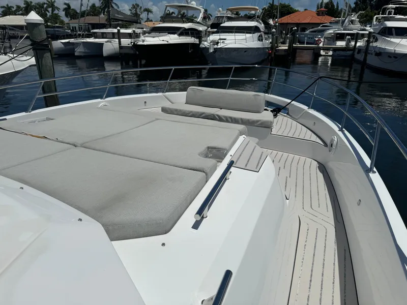 Slide: The Image of 2019 Azimut Verve 40 yacht with spacious deck and luxurious seating in marina. - 12