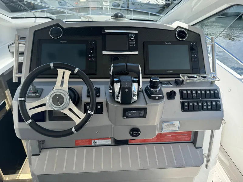 Slide: The Image of Cockpit of 2019 Azimut Verve 40 yacht with modern navigation controls and steering wheel. - 13