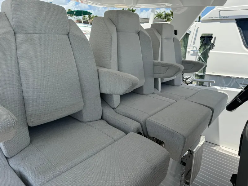 Slide: The Image of Luxury seating on 2019 Azimut Verve 40 yacht, featuring plush gray upholstery. - 15