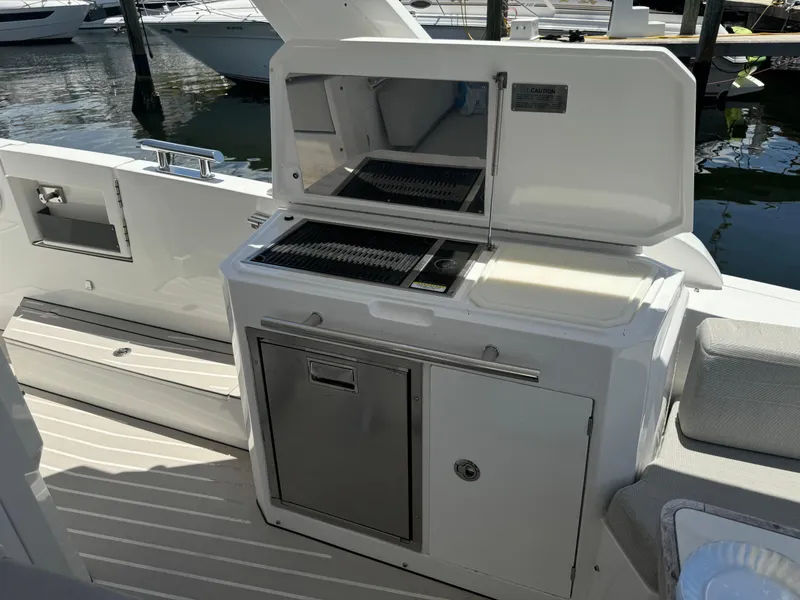 Slide: The Image of Outdoor kitchen on a 2019 Azimut Verve 40 yacht, featuring a grill and storage. - 20