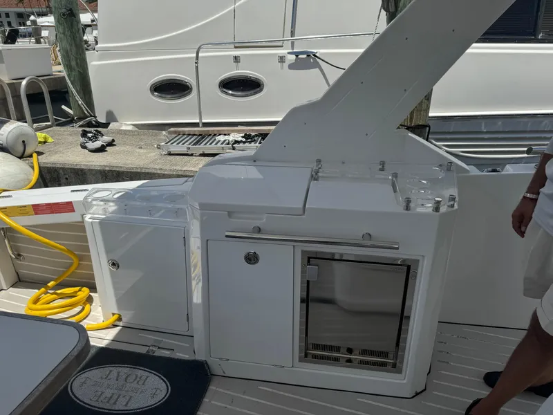 Slide: The Image of 2019 Azimut Verve 40 yacht deck with outdoor kitchenette and storage. - 22