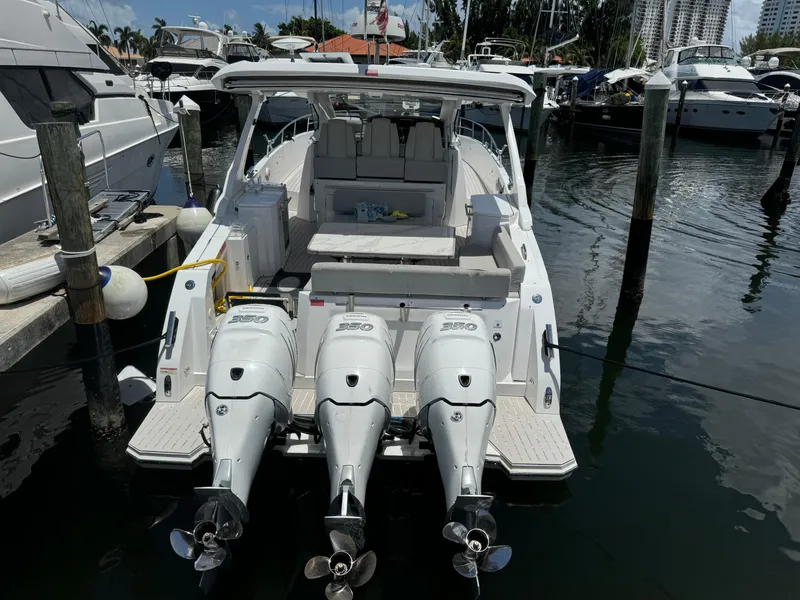 Slide: The Image of 2019 Azimut Verve 40 yacht docked, featuring triple outboard engines. - 3