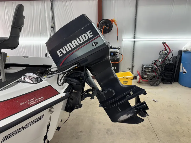 Slide: The Image of 2005 Hydra-Sports Z255 boat with Evinrude outboard motor in a garage setting. - 13