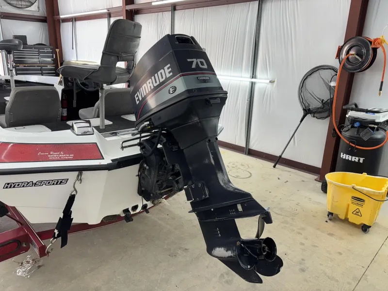 Slide: The Image of 2005 Hydra-Sports Z255 boat with Evinrude 70 outboard motor in a garage setting. - 3
