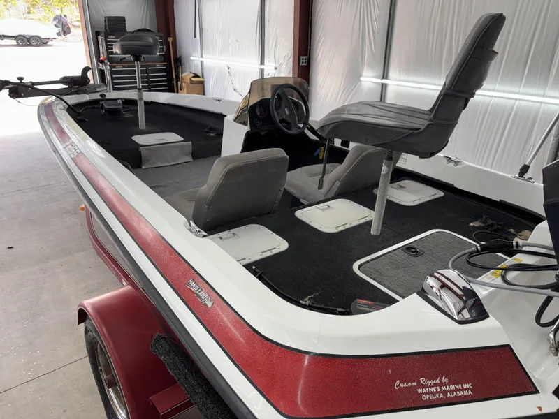 Slide: The Image of 2005 Hydra-Sports Z255 boat interior with seating and steering wheel in a garage setting. - 4