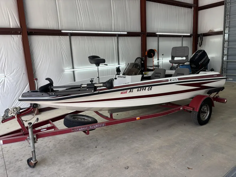 Slide: The Image of 2005 Hydra-Sports Z255 boat on trailer in garage, featuring Evinrude motor. - 9