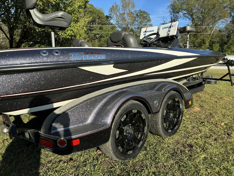 Slide: The Image of 2016 Triton 21 TrX Patriot boat on trailer, featuring sleek design and advanced equipment. - 14