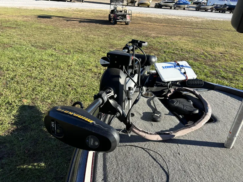 Slide: The Image of 2016 Triton 21 TrX Patriot boat with Minn Kota trolling motor and Lowrance equipment on deck. - 18