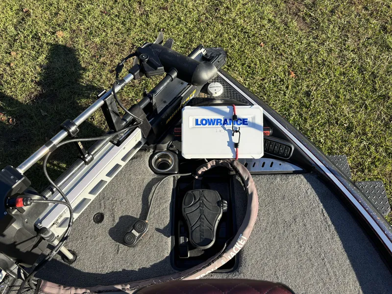 Slide: The Image of Triton 21 TrX Patriot 2016 boat deck with Lowrance equipment and trolling motor. - 19