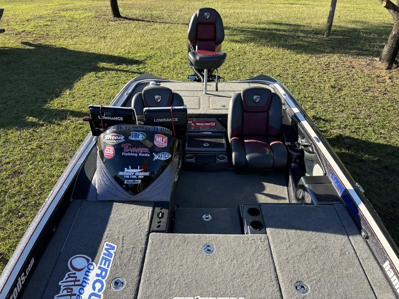 Slide: The Image of 2016 Triton 21 TrX Patriot fishing boat with dual Lowrance displays and custom seating. - 8