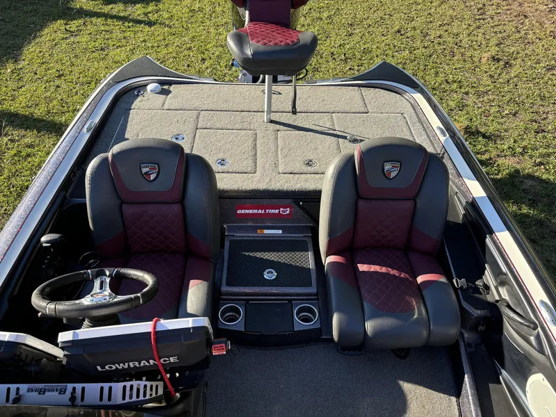 Slide: The Image of 2016 Triton 21 TrX Patriot boat interior with dual seats and steering wheel. - 9