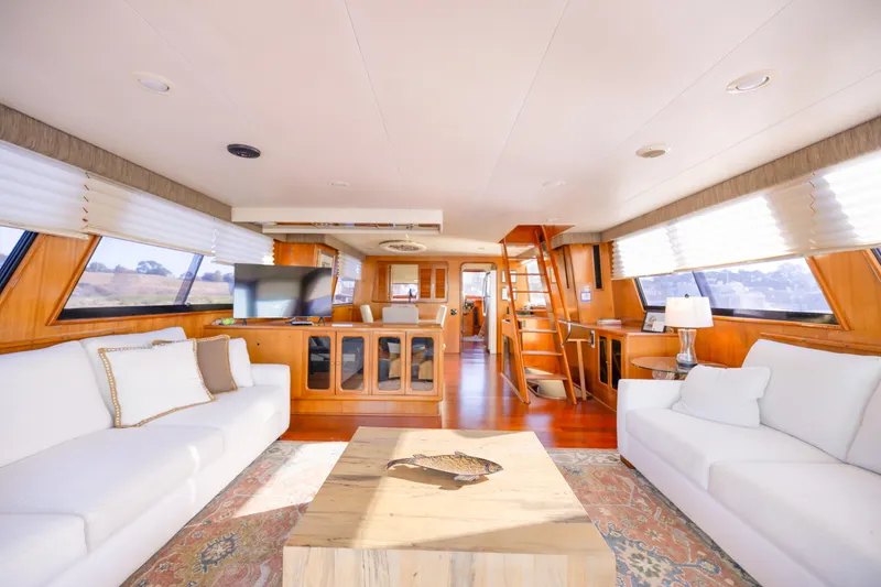 Slide: The Image of Luxurious interior of 1989 Viking 63 Motor Yacht with elegant furnishings and natural light. - 17