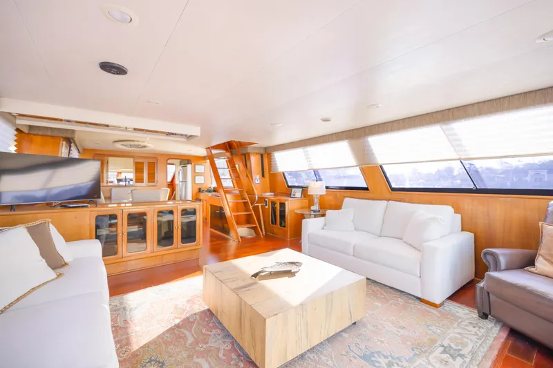 Slide: The Image of Luxurious interior of 1989 Viking 63 Motor Yacht with elegant seating and large windows. - 18
