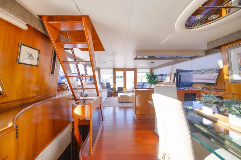 Slide: The Image of Luxurious interior of a 1989 Viking 63 Motor Yacht with elegant wood finishes. - 24