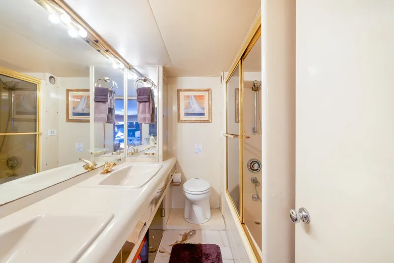 Slide: The Image of Luxurious bathroom in 1989 Viking 63 Motor Yacht with elegant fixtures and decor. - 29