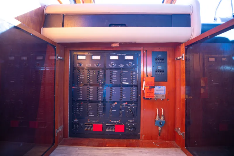 Slide: The Image of Electrical panel inside a 1989 Viking 63 Motor Yacht, featuring various switches and controls. - 37