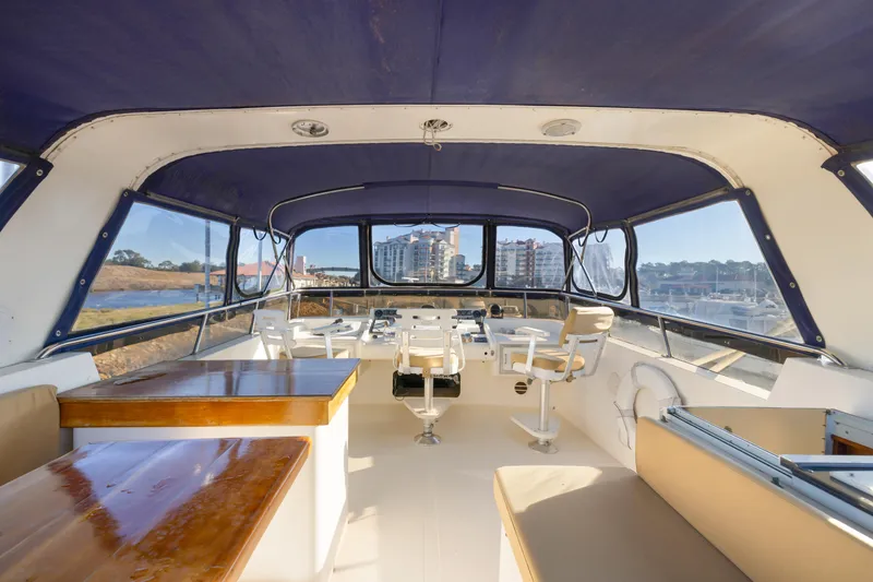 Slide: The Image of Interior view of 1989 Viking 63 Motor Yacht with seating and helm station. - 39