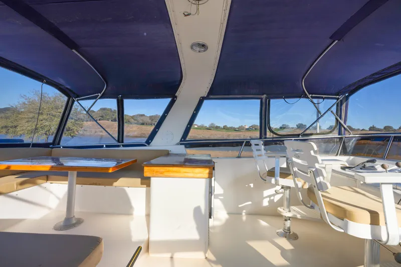 Slide: The Image of Interior view of 1989 Viking 63 Motor Yacht with seating and helm station. - 42