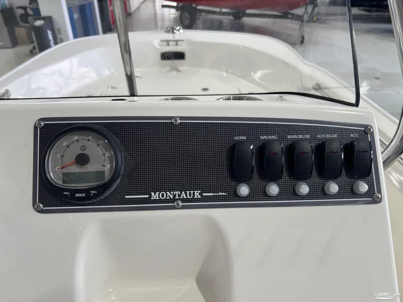 Slide: The Image of Dashboard of a 2025 Boston Whaler 170 Montauk boat with controls and gauge. - 10