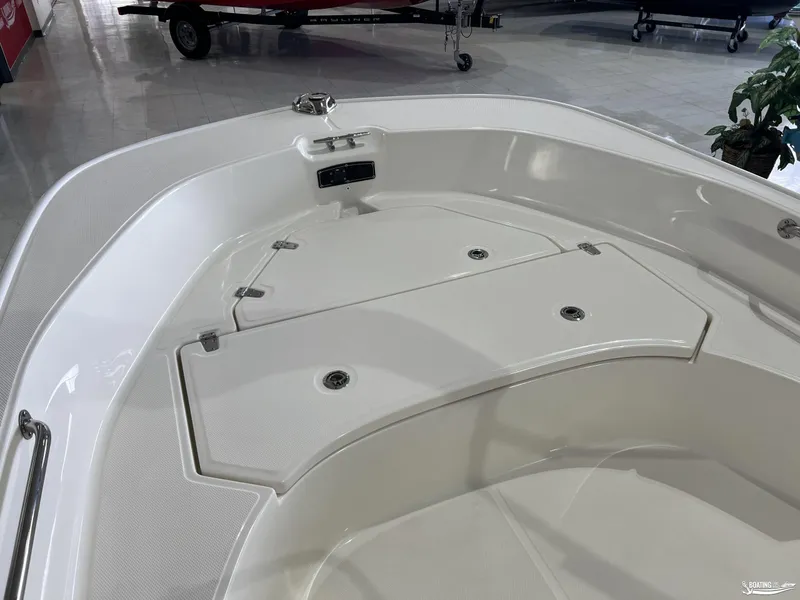 Slide: The Image of 2025 Boston Whaler 170 Montauk boat interior, showcasing storage compartments and sleek design. - 5