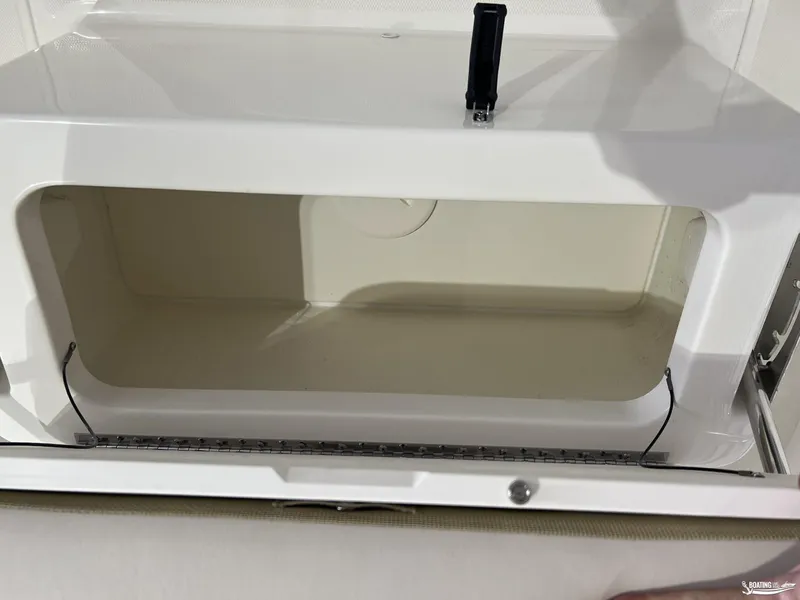 Slide: The Image of Storage compartment of 2025 Boston Whaler 170 Montauk boat, open and empty. - 9