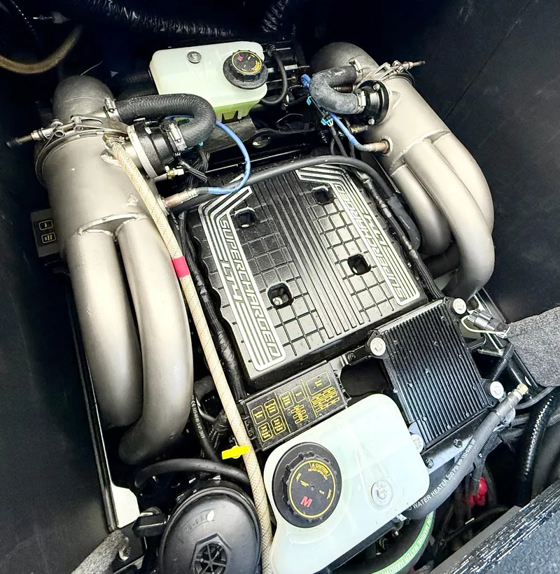Slide: The Image of 2021 Malibu M240 engine compartment showcasing powerful inboard motor components. - 16