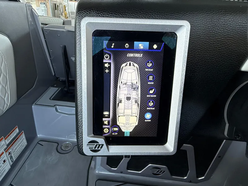 Slide: The Image of Touchscreen control panel in a 2021 Malibu M240 boat interior. - 27