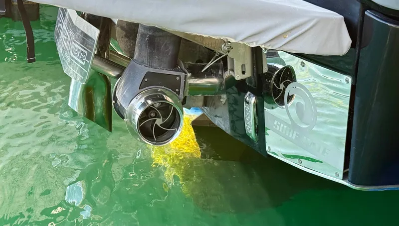 Slide: The Image of 2021 Malibu M240 boat exhaust system in water, showcasing sleek design and engineering. - 34