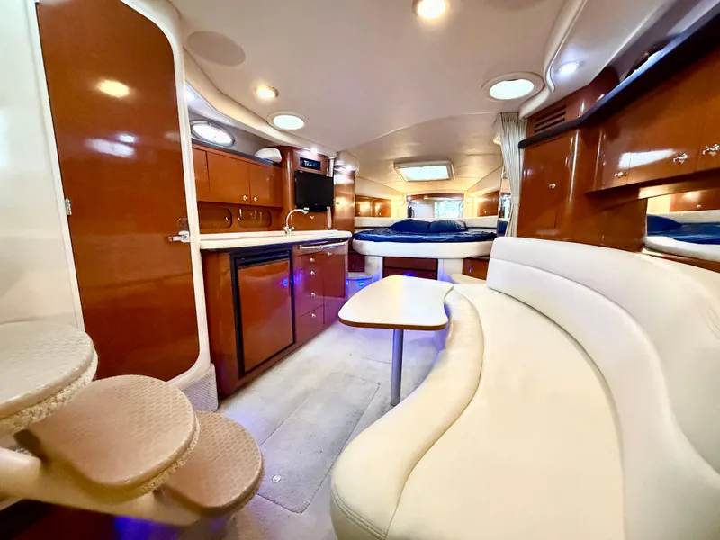 Slide: The Image of Luxurious interior of 2004 Sea Ray 340 Sundancer yacht with elegant seating and modern amenities. - 18