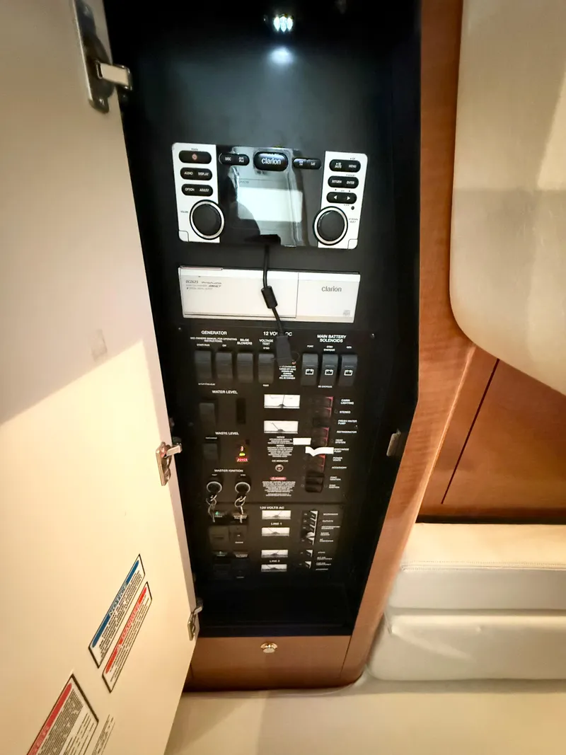 Slide: The Image of Electrical control panel inside a 2004 Sea Ray 340 Sundancer boat. - 27