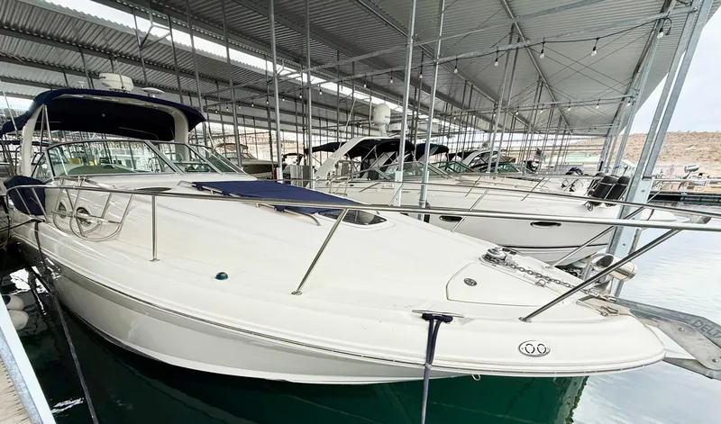 Slide: The Image of 2004 Sea Ray 340 Sundancer docked in a covered marina. - 7