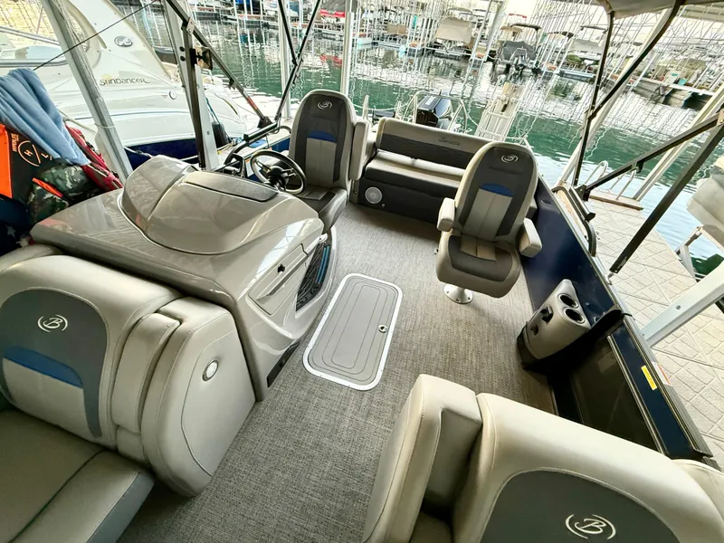 Slide: The Image of 2024 Barletta Corsa 23UC boat interior with plush seating and modern design. - 10