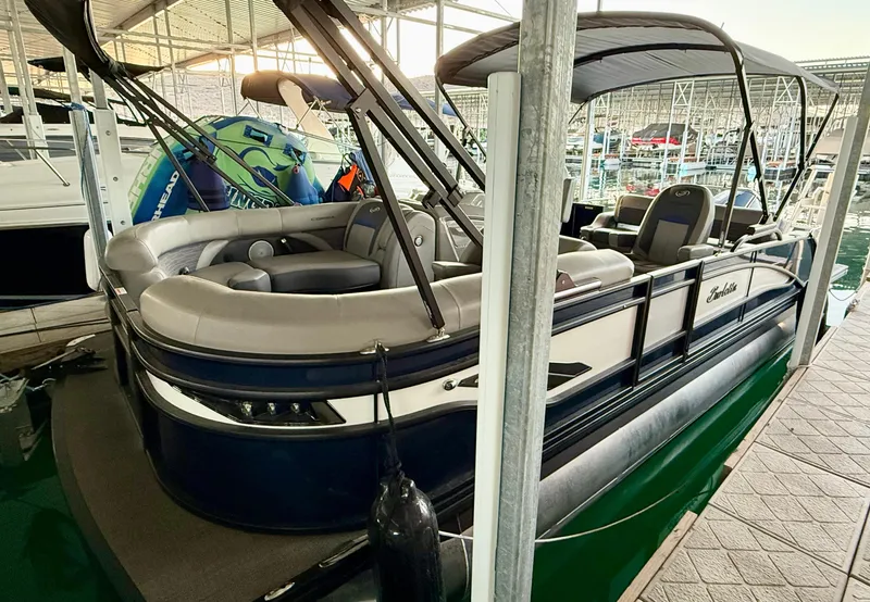 Slide: The Image of 2024 Barletta Corsa 23UC pontoon boat docked in marina. - 12