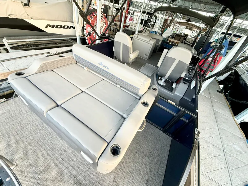 Slide: The Image of 2024 Barletta Corsa 23UC pontoon boat with spacious seating and modern design. - 17