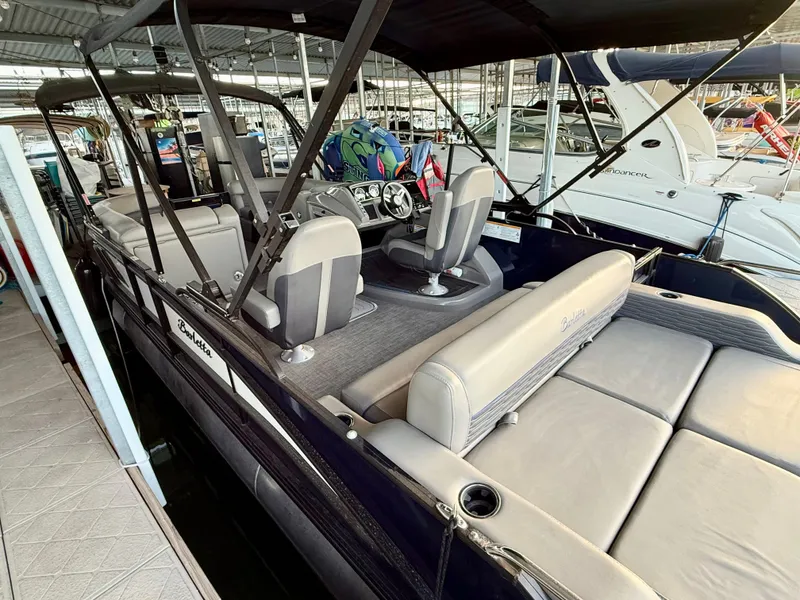 Slide: The Image of 2024 Barletta Corsa 23UC pontoon boat interior with seating and helm. - 4