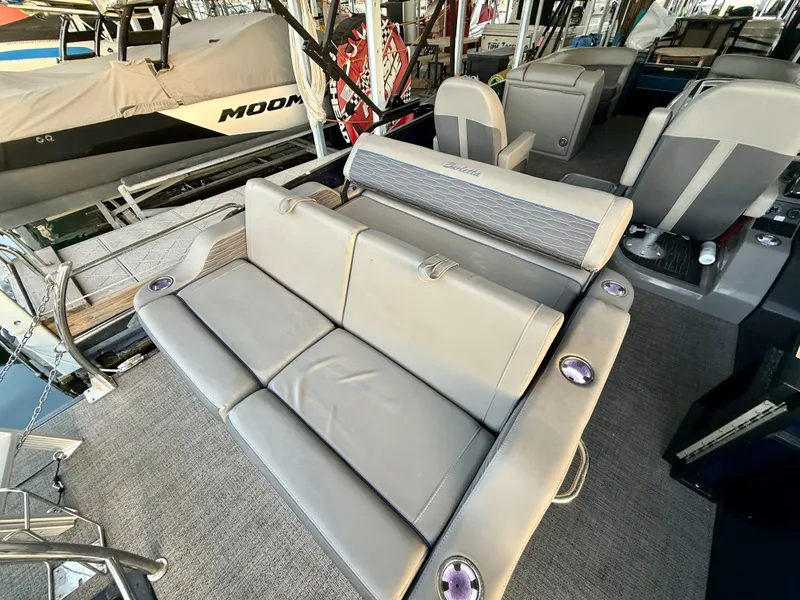 Slide: The Image of 2024 Barletta Corsa 23UC boat interior with plush seating and modern design. - 6